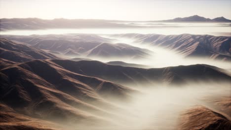 mountain landscape with deep fog at morning