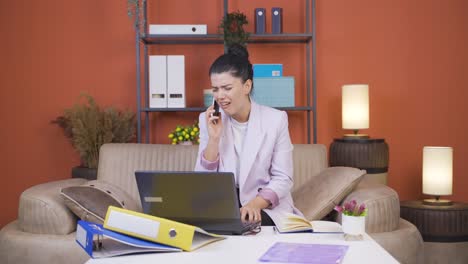 Home-office-worker-young-woman-getting-bad-news-on-the-phone.