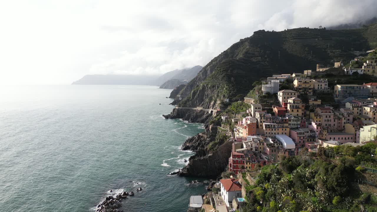 Riomaggiore Cinque Terre Italy aerial reverse flight along cliffs