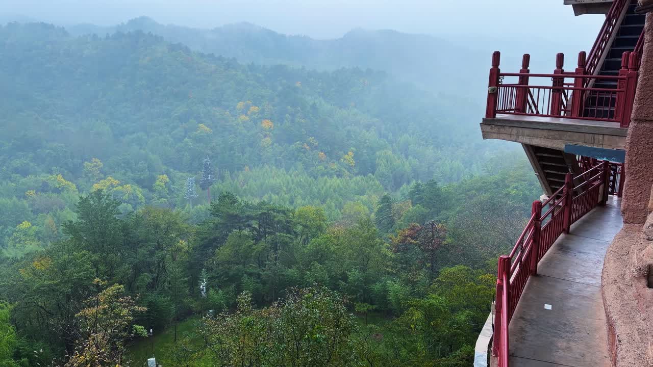 Cantilevered Walkways Connect The Various Caves At Maijishan Grottoes In Tianshui, Gansu Province, China. Pan Right Shot