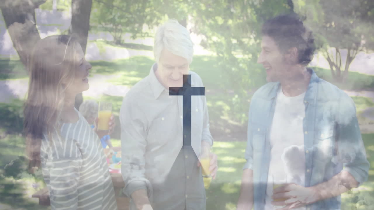 Gathering outdoors, people holding drinks with animation of cross symbol overlay