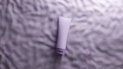 purple cosmetic tube on textured background