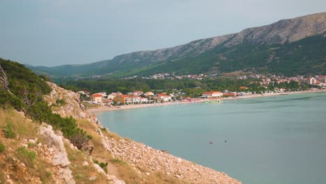 view from cliff on baška bay surrounded by mountains