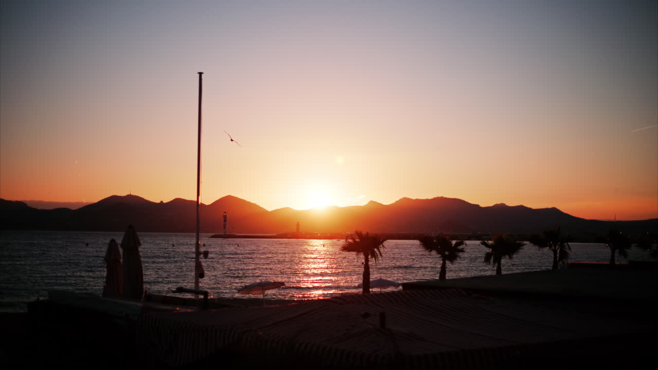 View of a beach in the French Riviera at sunset