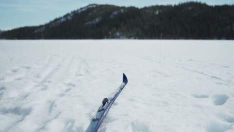 skis sliding smoothly on snow covered field - close up