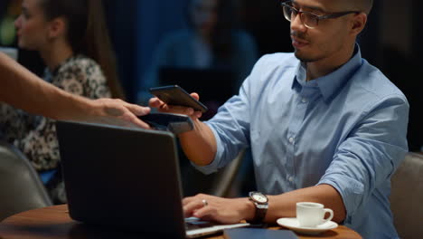 Indian-businessman-using-laptop-in-cafe.-Male-programmer-working-on-laptop