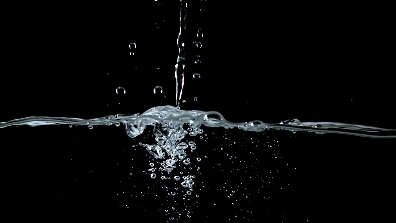 Fresh Water Pouring and Splashing with Bubbles on Black Background