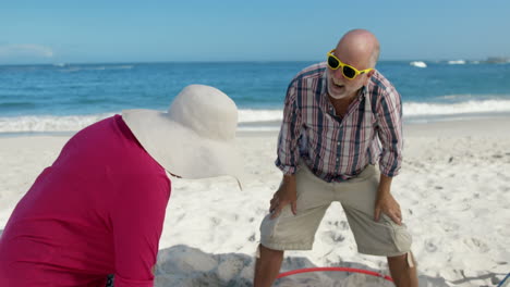 Senior-couple-doing-hula-hoop