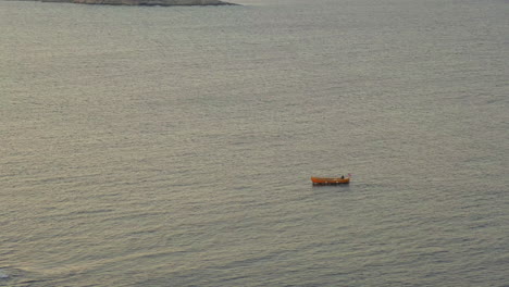 Boat-Sailing-At-The-Calm-Ocean-Near-Store-Torungen-Island-In-Arendal-Town,-Norway