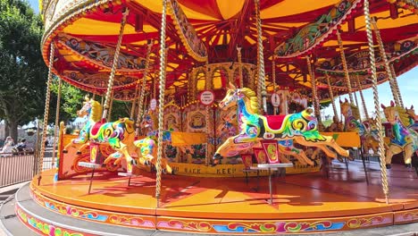 brightly decorated carousel spinning in a london park