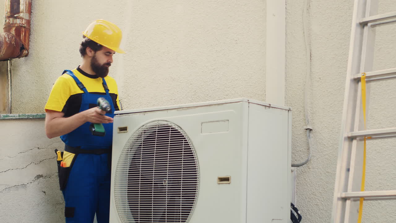 Engineer dissasembling air conditioner