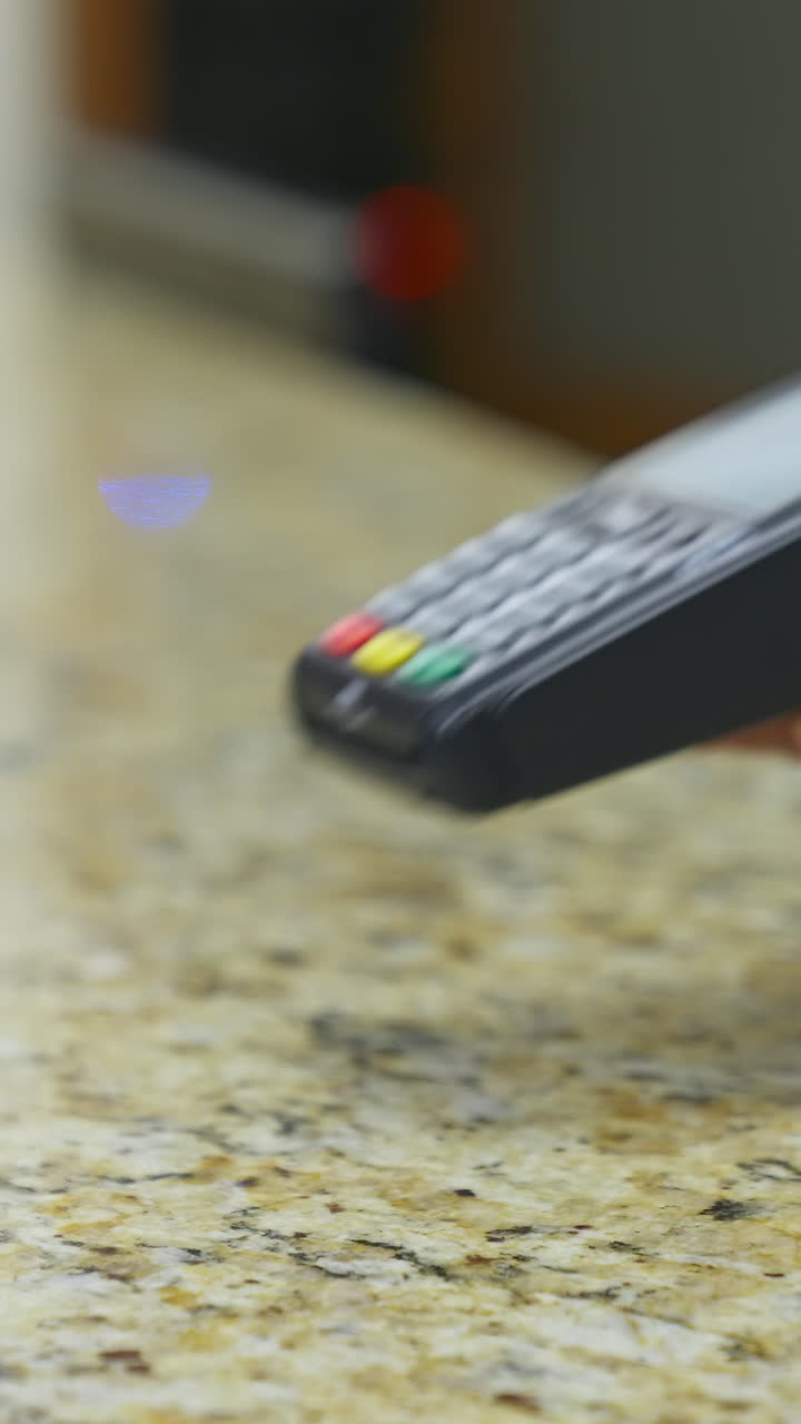 Traveler at hotel reception. Customer paying for services in hotel. Vertical video