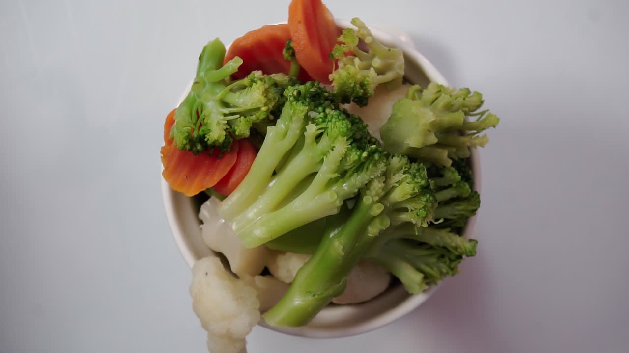 Healthy Bowl Of Broccoli, Carrots And Cauliflower. - top down shot