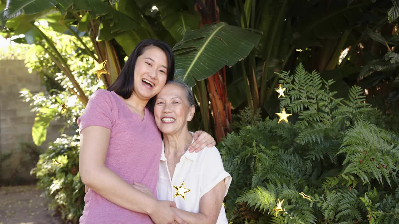 Mother-daughter smiling, hugging in garden, touching initiating gold star overlay for marketing