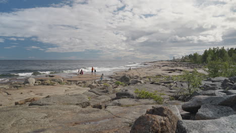 People-on-Holiday-at-coast-landscape-of-Rotsidan,-Hoga-kusten,-Sweden