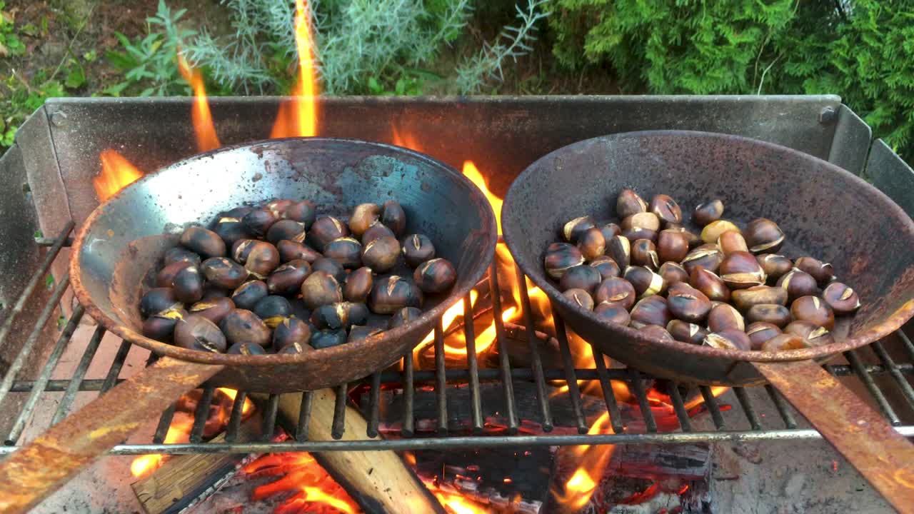 Chestnuts roasted on open fire, seasonal delicacy, harvest, 4k UHD, crane shot from low to high angle