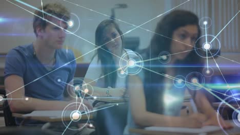 Glowing-network-of-connections-against-group-of-students-studying-sitting-on-their-desks-in-class