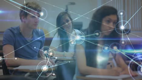 red brillante de conexiones contra un grupo de estudiantes que estudian sentados en sus escritorios en clase