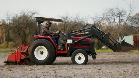 farmer operating a tractor in a field