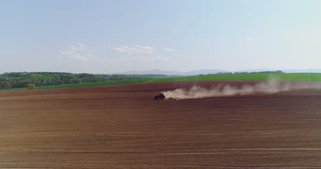 tractor working in beautiful spacious agricultural field 3