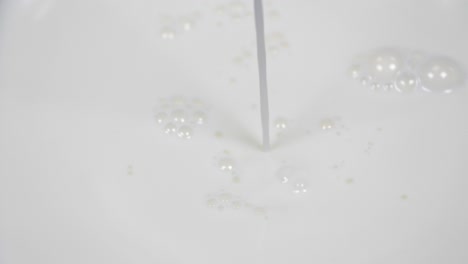 pouring fresh milk in super slow motion 4k