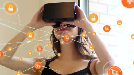 Animation-of-network-of-connections-with-icons-over-woman-wearing-vr-headset