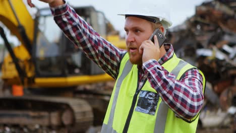 Male-worker-talking-on-mobile-phone-4k