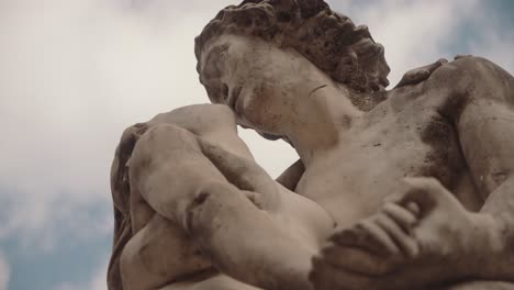 low angle shot of a man and a woman sculpture