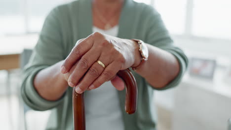 hands, walking stick and senior woman