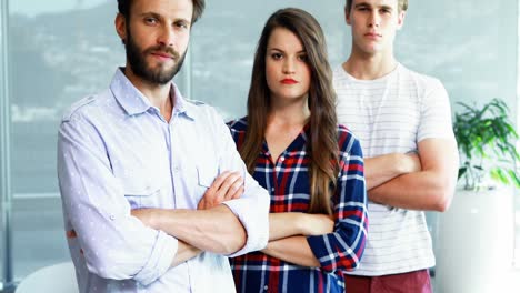 portrait of executives standing with arms crossed