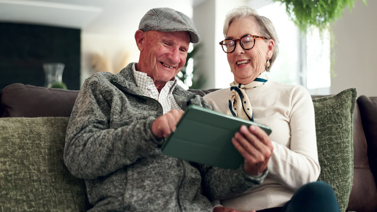 Elderly Couple Enjoying Tablet Together at Home