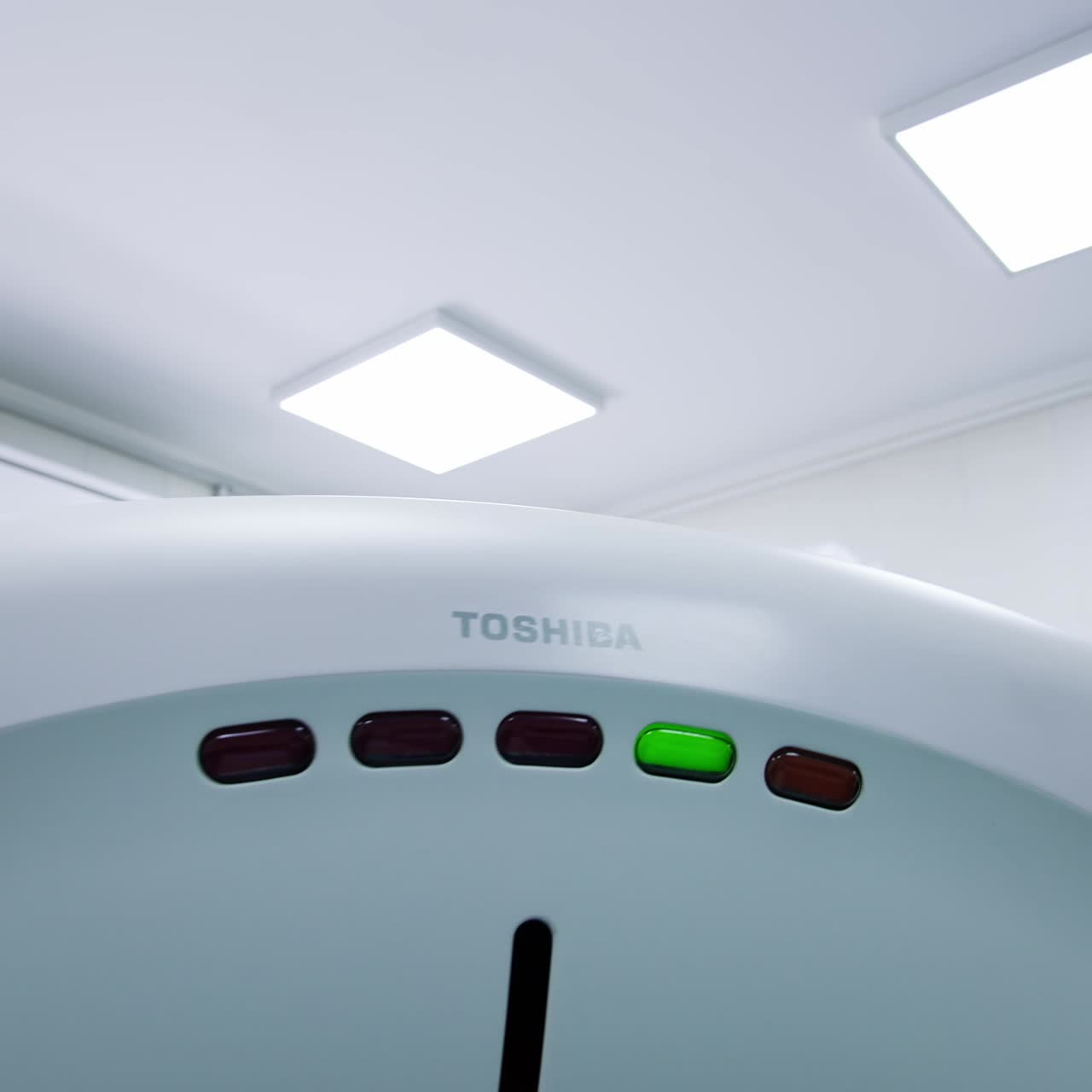 Empty hospital room with tomography machine in the middle. Magnetic resonance imaging machine. Low angle view