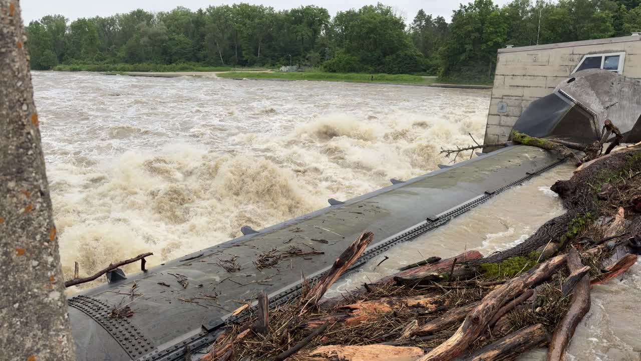 River Donau near peak level, during flood in bavaria, barrage bergheim near ingolstadt full of flotsam