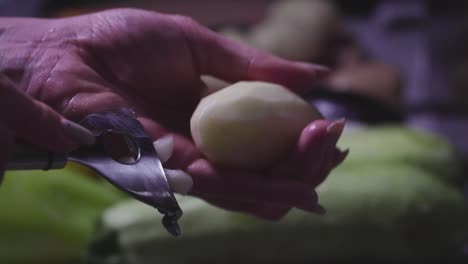 women's hands wash, peel and cut vegetables into vegetable stew