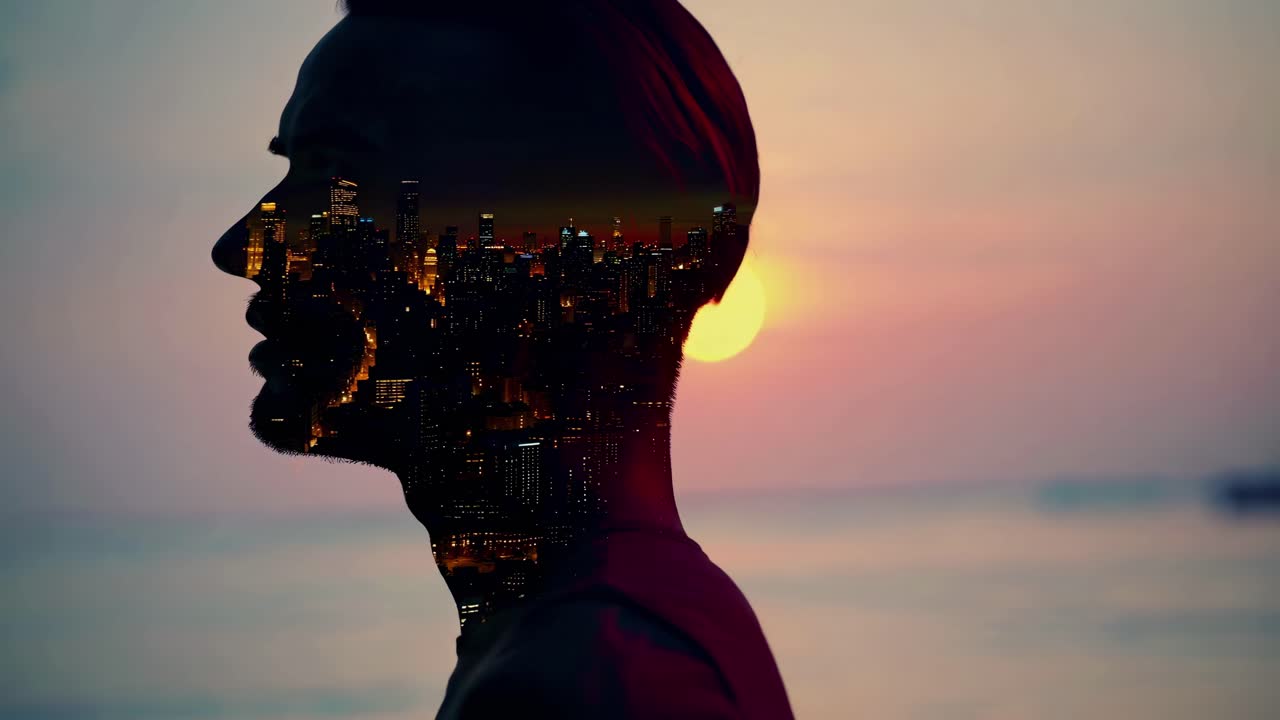 Double exposure video concept with a silhouette of a man and a cityscape at sunset
