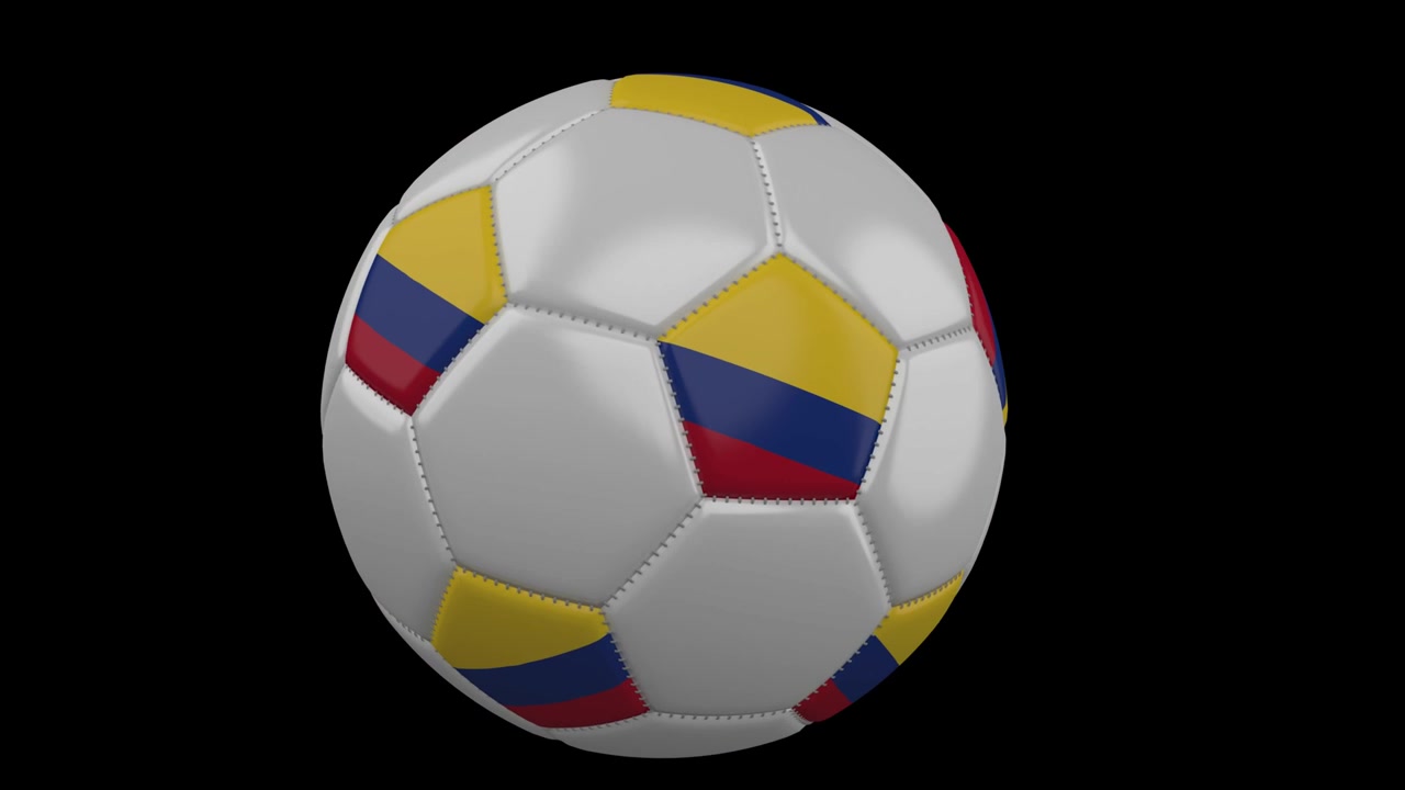 Pallone da calcio con bandiera della Colombia che vola davanti alla telecamera, slow motion, canale alpha
