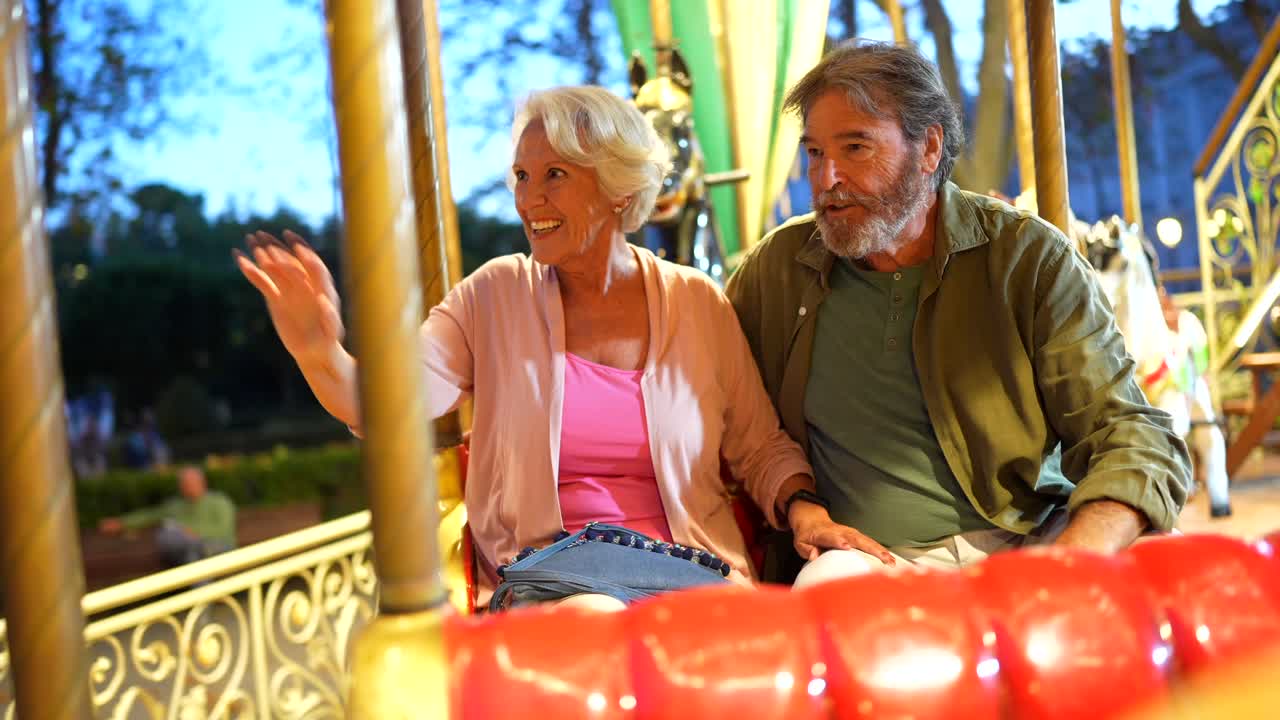 Senior Couple Enjoying a Carousel Ride