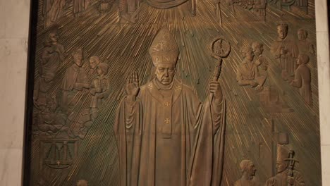 carving of a holy man on the wall of the archcathedral basilica of st