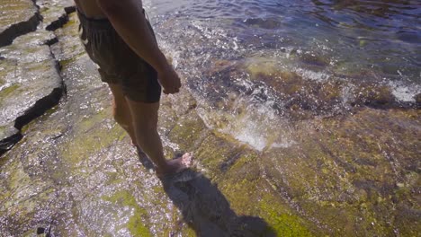 feet in the sea in slow motion.