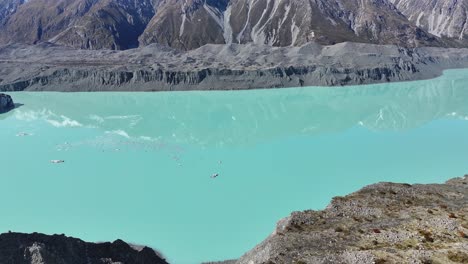 beautiful glacial water of tasman lake, drone reveals scenic mountain vista