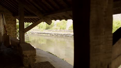 flowing river through township of vannes il bretagne ,view from inside ancient building