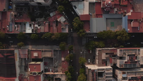 Aerial-birds-eye-overhead-top-down-view-of-various-buildings-in-urban-neighbourhood.-Vertical-panning-footage.-Mexico-City,-Mexico.