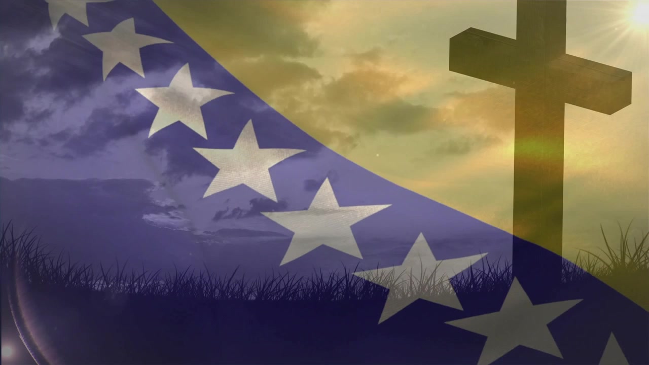 Brisa começando, bandeira azul-dourada tremulando, estrelas se movendo, sol brilhando atrás da cruz, revelando a cruz.