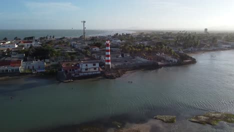 AERIAL-DOLLY-IN-Lighthouse-And-Coastal-Village-Of-Adicora,-Venezuela