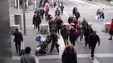 people crossing the road at melbourne southern cross station main entrance, victoria melbourne - winter