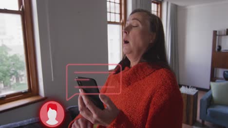 Animation-of-icon-with-data-processing-over-caucasian-woman-sneezing-using-smartphone