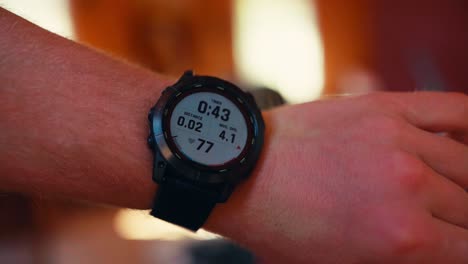 man showing health timer of solar charging smartwatch on his wrist