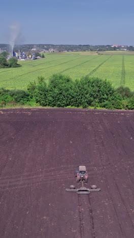 aerial view of the tractor plow a ground