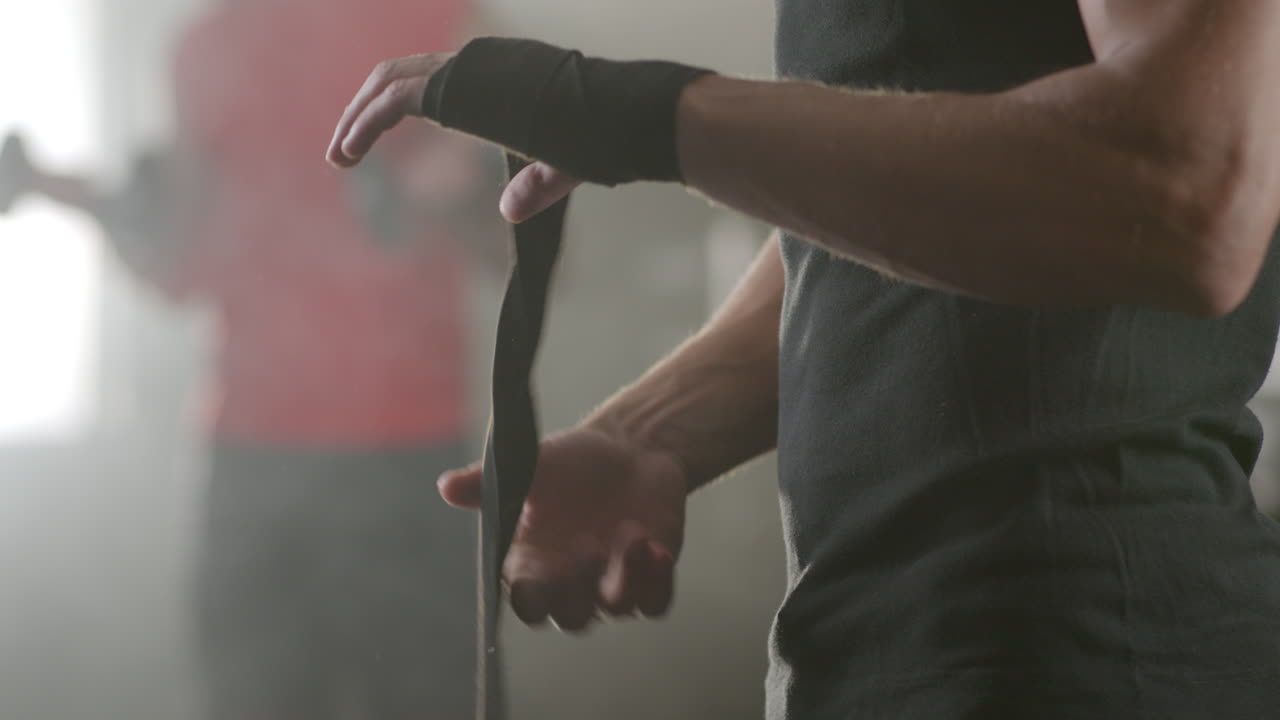 Man Wrapping Hands with Hand Wraps