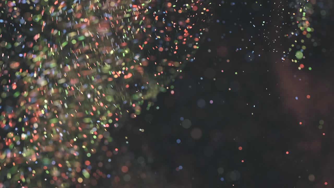 어두운 배경에서 떠다니는 마법의 가루, 느린 동작